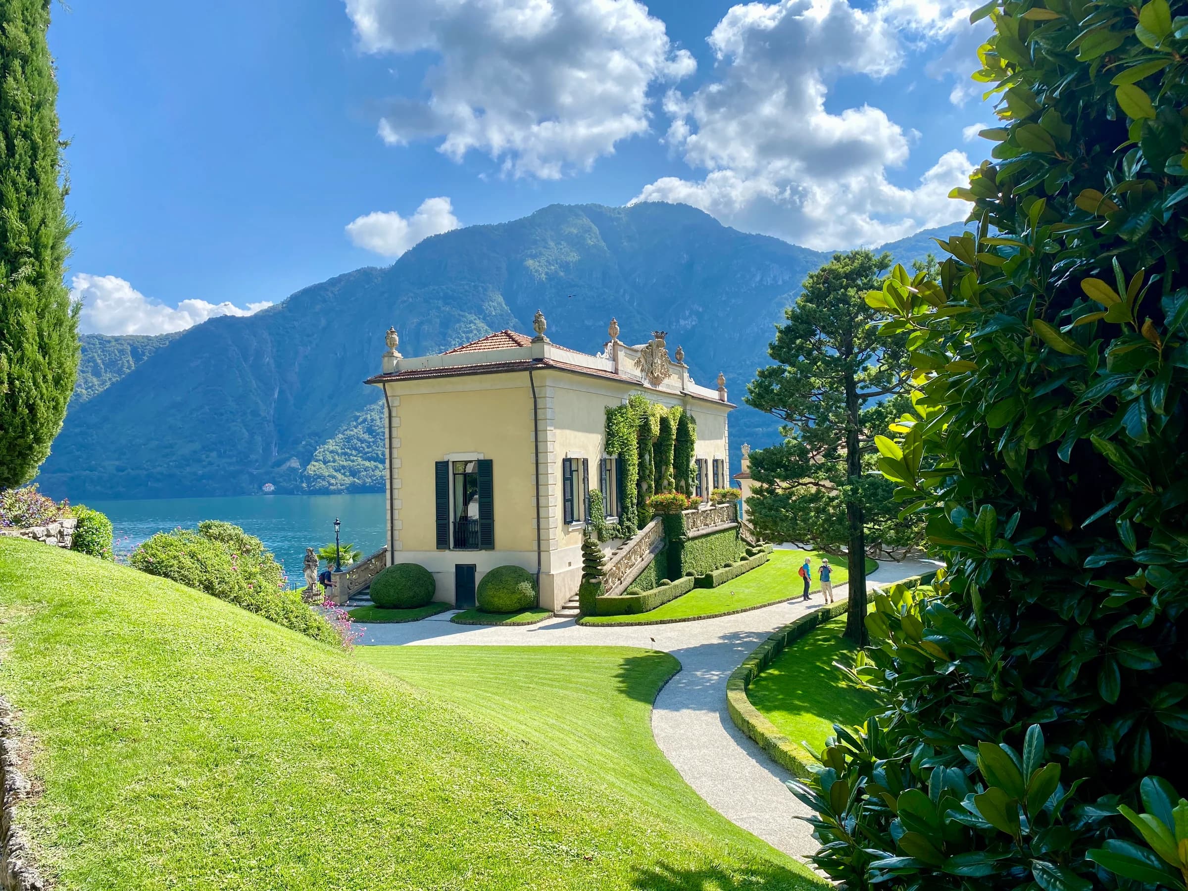 Lake Como villa gardens framed by mountains and blue water