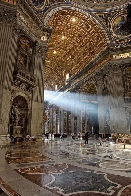 Sunlight streaming through the interior of St. Peter's Basilica in Vatican City